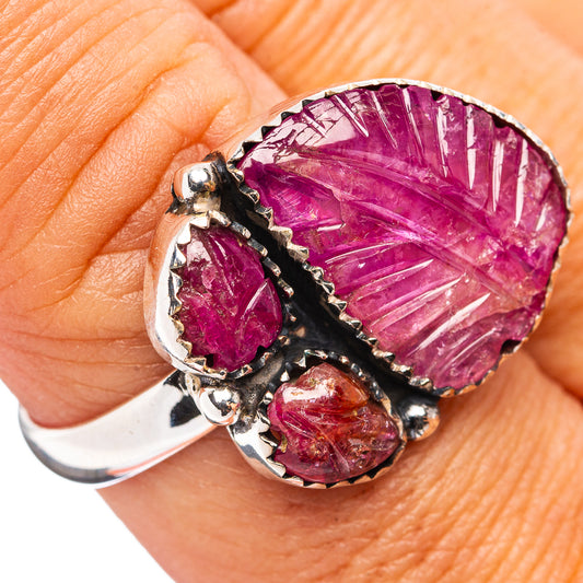 Sterling silver ruby ring with large oval pink-red carved stone and black setting