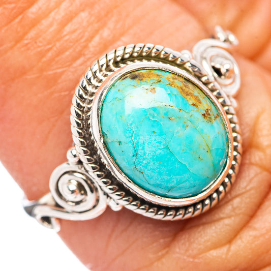 Turquoise cabochon ring in .925 sterling silver with rope-edge bezel and swirl details