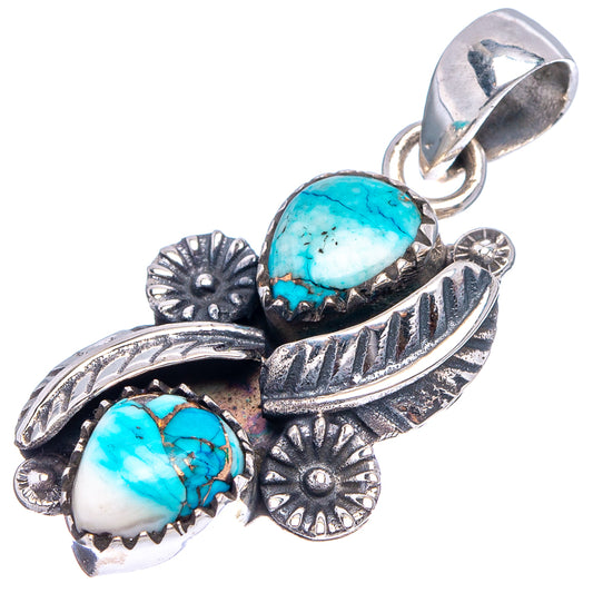 Turquoise cabochon pendant with ornate floral motifs and engraved .925 sterling silver frame