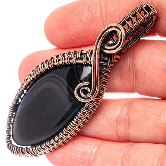 Oxidized copper wire-wrapped banded agate pendant with teardrop stone and loop bail