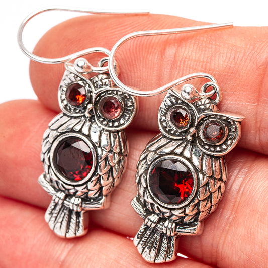 Sterling silver owl drop earrings with red garnet-style round stones