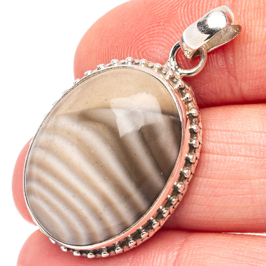 Striped flint pendant in .925 sterling silver, oval stone with beaded edge and bail