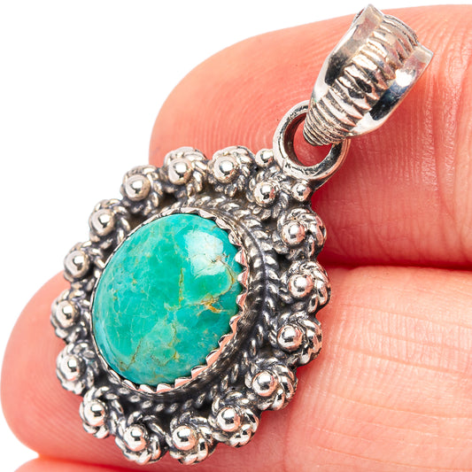 Sterling silver turquoise pendant with ornate beaded oval setting and bail
