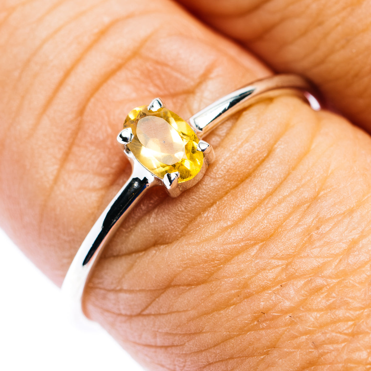 Sterling silver stackable ring with oval yellow citrine, prong-set band
