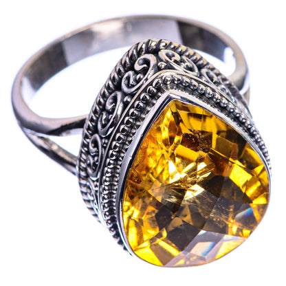 Sterling silver citrine ring showing faceted oval yellow stone and engraved side detailing