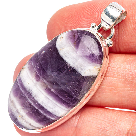 Oval amethyst pendant with purple stone, white band, sterling silver bail