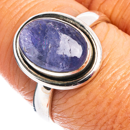 Sterling silver ring with oval blue tanzanite gemstone in double bezel