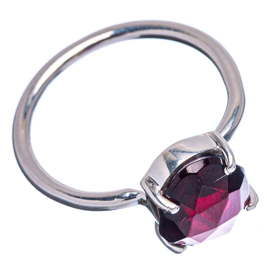 Oval faceted garnet ring in prong setting with .925 sterling silver band