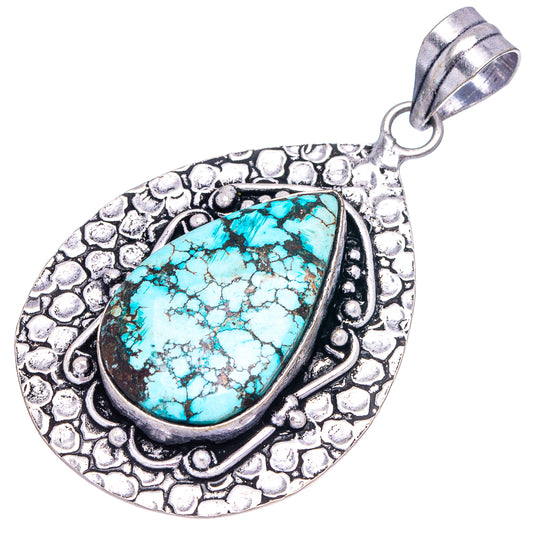 German silver turquoise teardrop pendant, textured frame and circular bail
