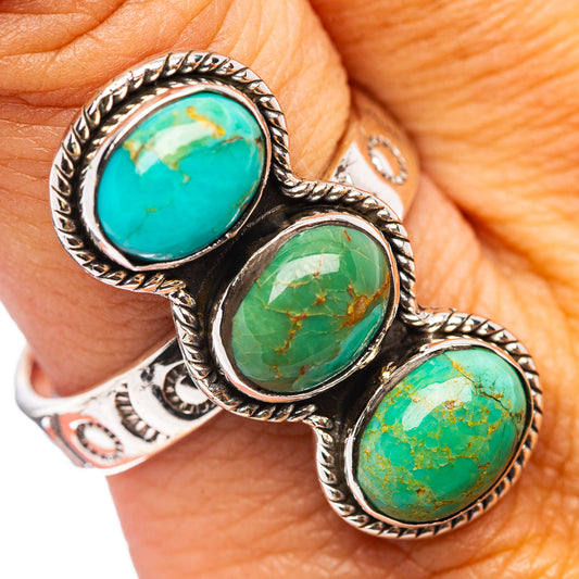 Three turquoise cabochon stones in ornate sterling silver adjustable band