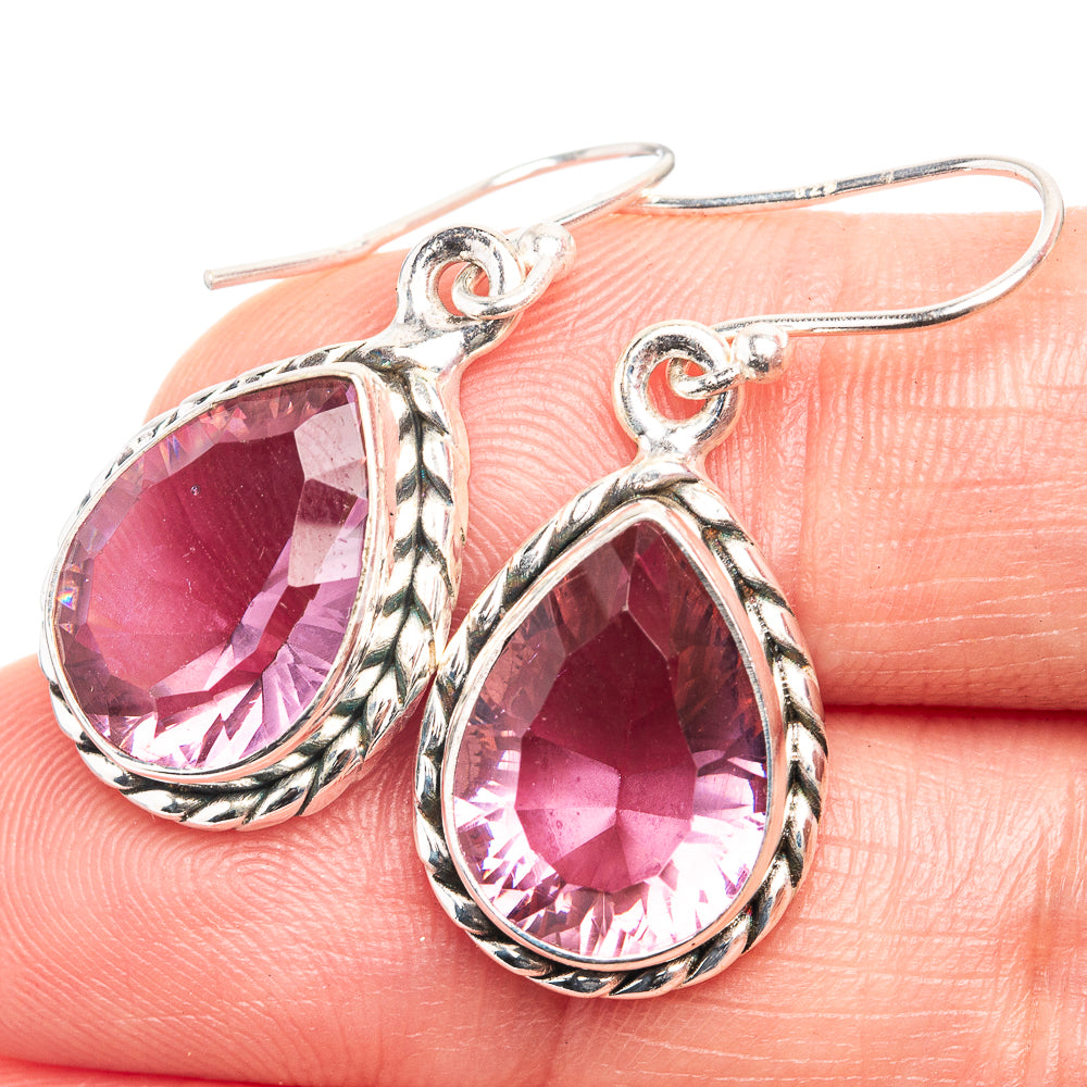 Sterling silver drop earrings with pink oval faceted color-change gemstone