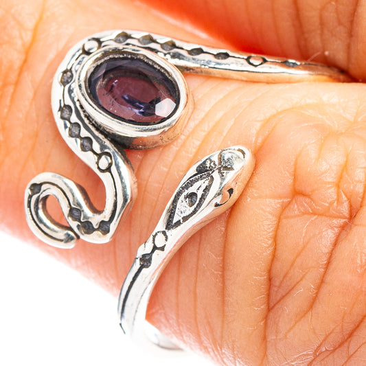 Dainty sterling silver snake ring with dark oval Iolite-style gemstone, detailed openwork