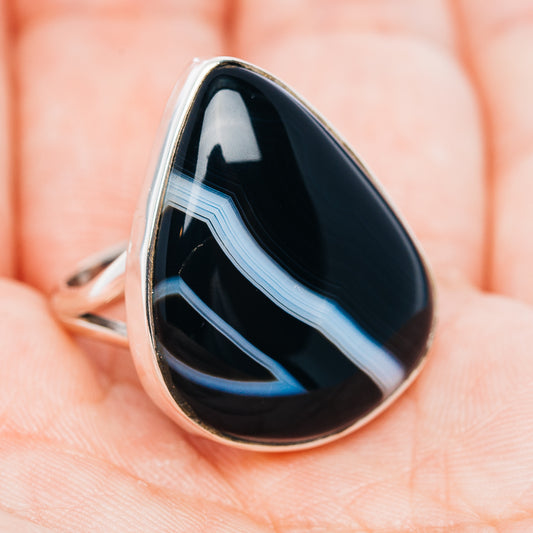 Black banded agate teardrop ring with .925 sterling silver bezel, angled close-up