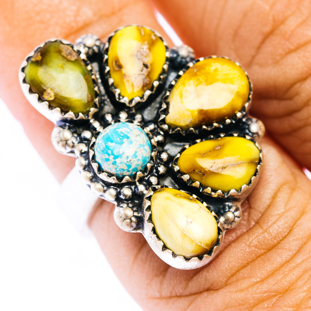 Turquoise and yellow oval gemstone ring with black bezel, silver beaded details
