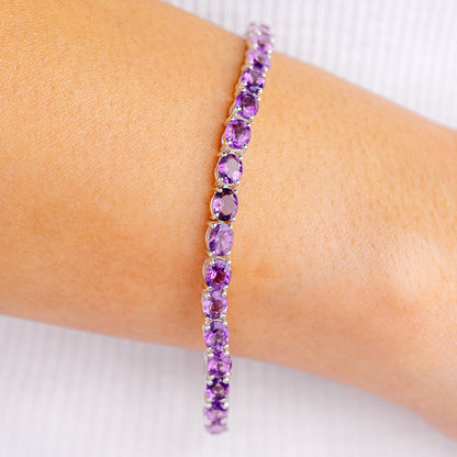 Amethyst tennis bracelet with oval purple gemstones in sterling silver band