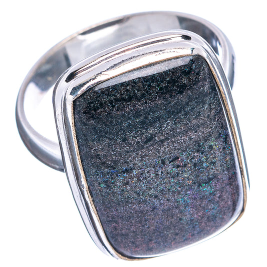 Sterling silver opal ring with oval band; dark rectangular gemstone with rainbow flecks