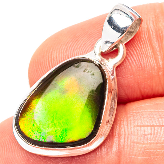 Sterling silver ammolite pendant with oval teardrop gemstone, iridescent green and gold.