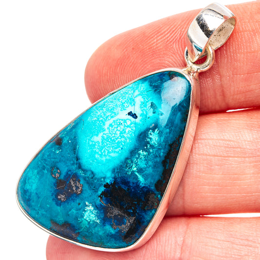 Teardrop shattuckite pendant with turquoise blue stone in silver bezel