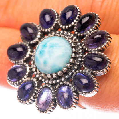 Sterling silver ring with oval light-blue larimar center and purple oval bezel stones