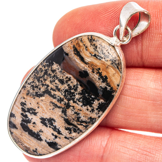 Silver-plated oval dendrite pendant with brown, black, and cream stone