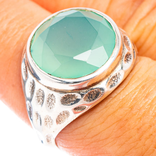 Sterling silver ring with faceted oval aqua chalcedony and textured band
