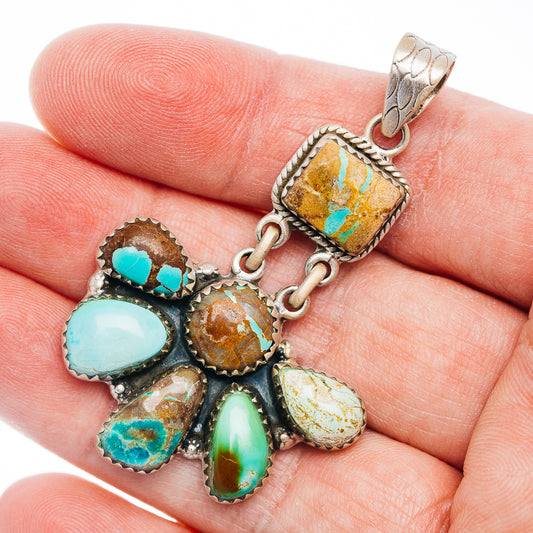 Turquoise inlay sterling silver pendant with teardrop stones and ornate ribbon bail