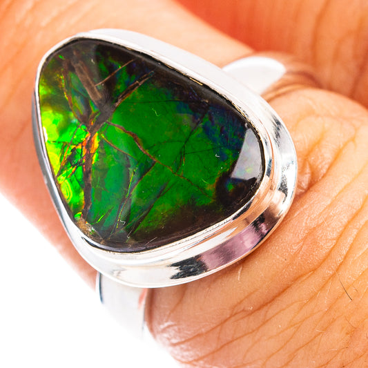 Sterling silver ammolite ring with oval green iridescent stone in bezel setting