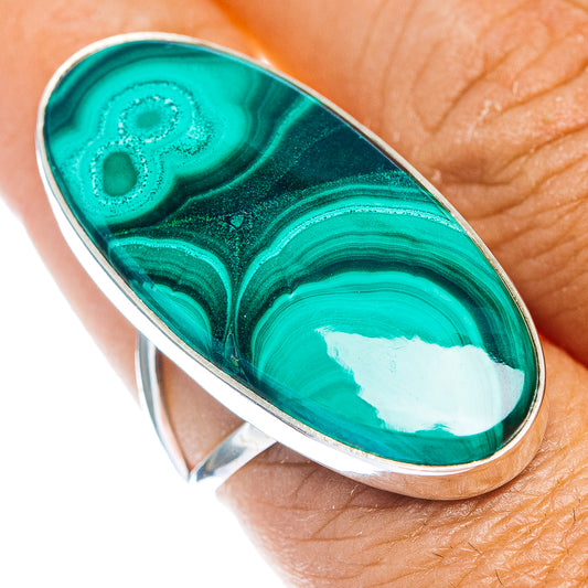 Oval malachite gemstone ring with silver bezel, turquoise and dark green pattern