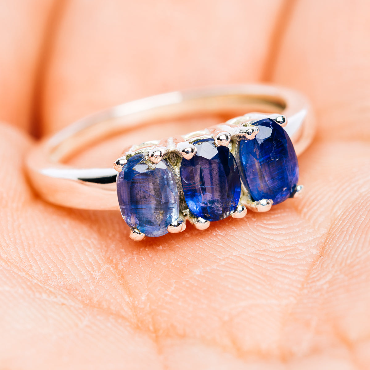 Sterling silver three-stone kyanite ring with three oval blue gems
