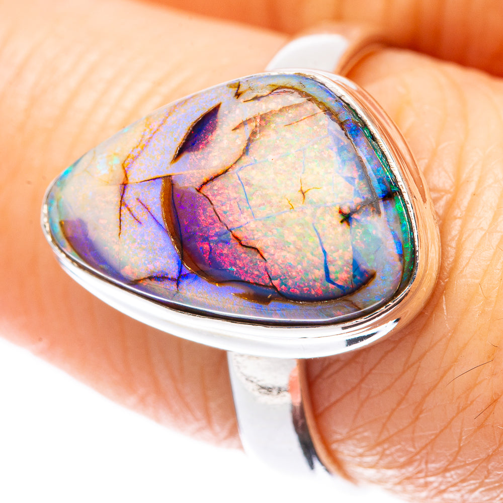 Sterling silver oval opal ring with iridescent blue, pink and green stone