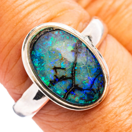 Oval opal gemstone ring in .925 sterling silver, blue-green stone with starburst pattern