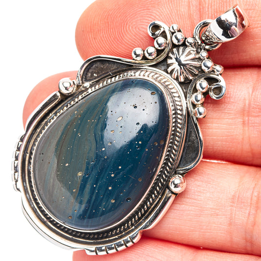 Blue slag oval pendant in .925 sterling silver with ornate bezel and bail