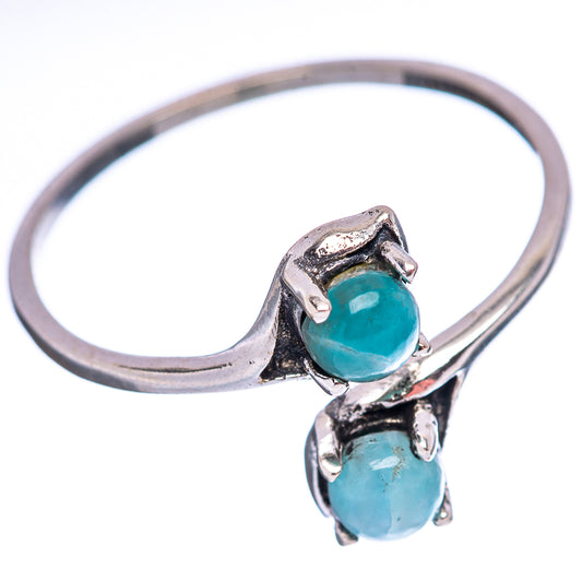Sterling silver band ring with two stacked oval aqua larimar stones, prong-set detail