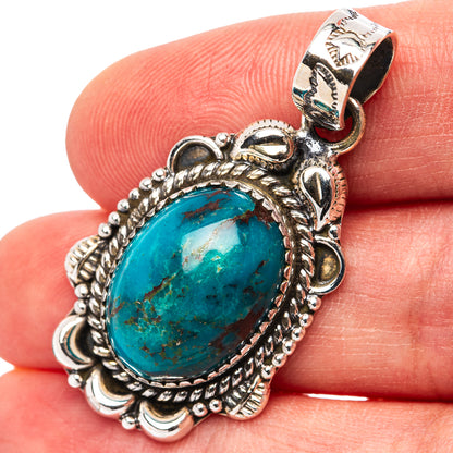 Oval turquoise pendant in ornate .925 sterling silver setting with bead border