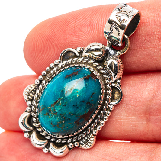 Oval turquoise pendant in ornate .925 sterling silver setting with bead border