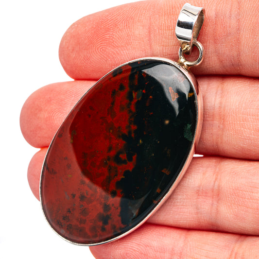 Bloodstone oval pendant with sterling silver bezel and hanging bail, red and dark mottling