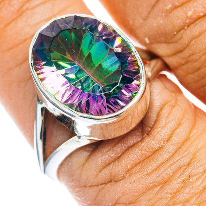 Sterling silver ring with oval iridescent faceted gemstone, green and purple flashes