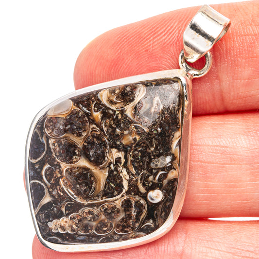 Teardrop turritella agate pendant with .925 sterling silver bezel and dark fossil pattern