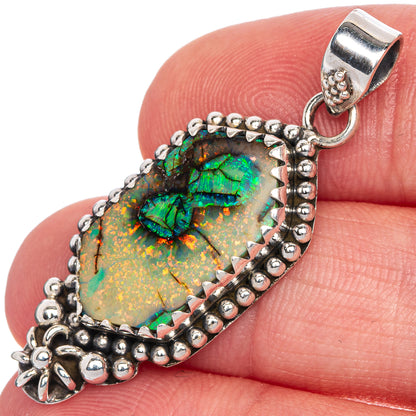 Sterling silver opal pendant with oval green-and-gold opal center and beaded border