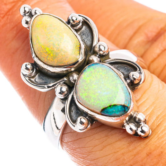 Sterling silver opal ring with two oval stones, one yellow-green and one blue-green