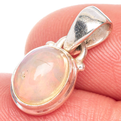Oval Ethiopian opal pendant, orange-peach cabochon in 925 sterling silver bezel