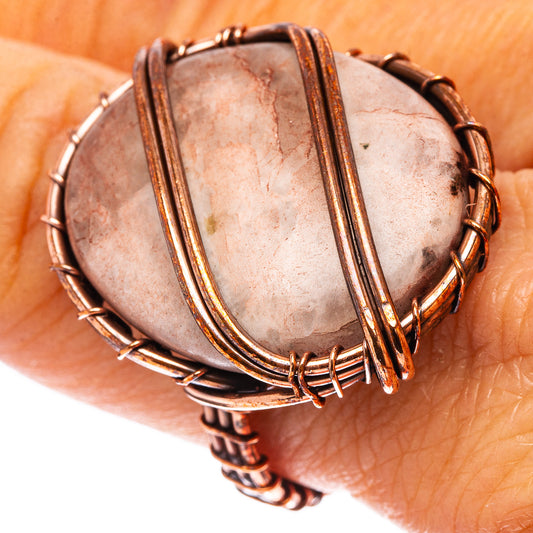 Quartz ring, size 8, oval pink stone with oxidized copper wire wrap on hand