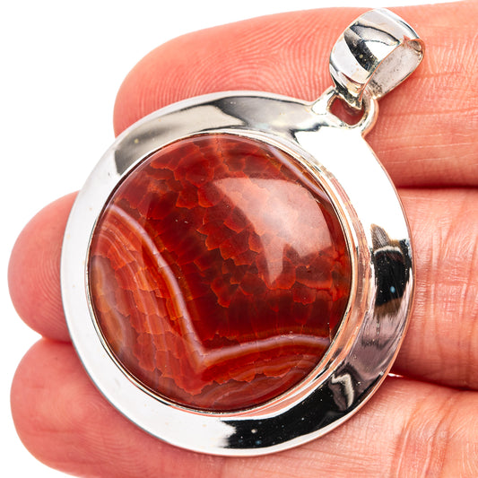 Round fire agate pendant in .925 sterling silver bezel with lobster clasp bale