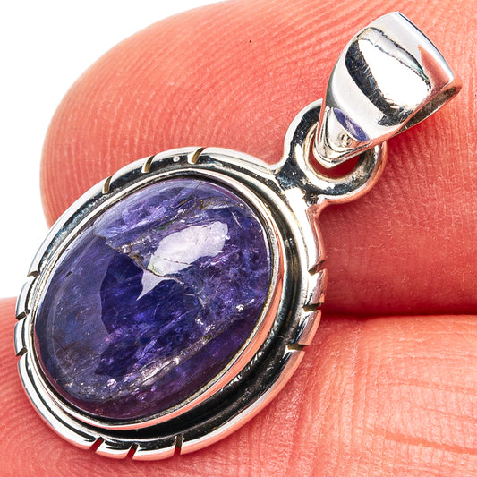 Sterling silver tanzanite pendant with oval blue gemstone cabochon, scalloped bezel