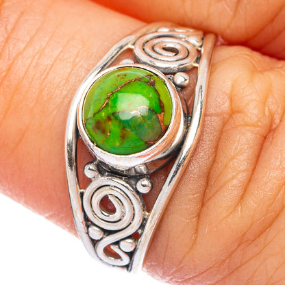 Sterling silver dainty ring with green oval turquoise cabochon and spiral scrollwork