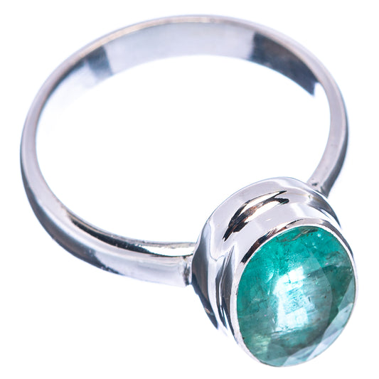 Zambian emerald ring in .925 sterling silver with raised bezel and faceted green gemstone