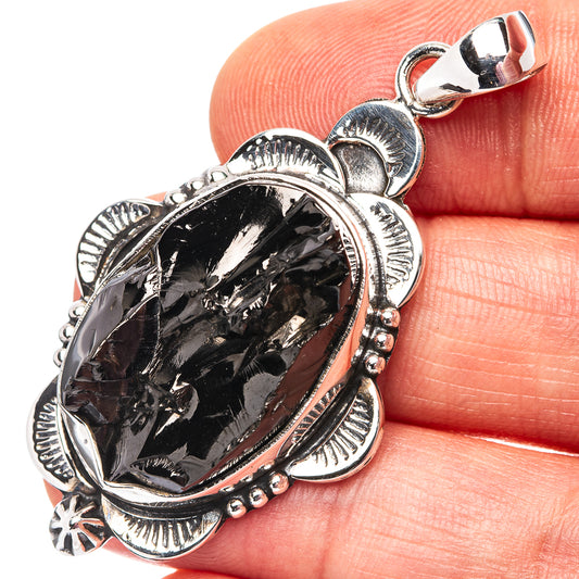 Oval shungite pendant in .925 sterling silver with ornate bezel and scalloped edge