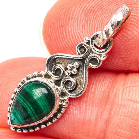 Oval malachite pendant in .925 sterling silver with ornate filigree and loop bail