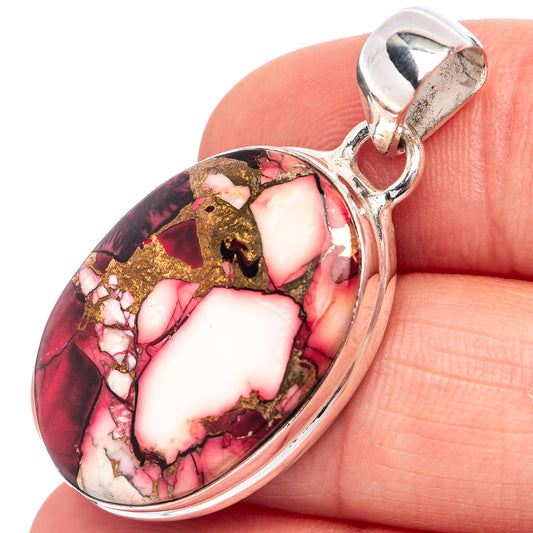 Oval stone pendant close-up in .925 sterling silver with red, cream, and gold mosaic