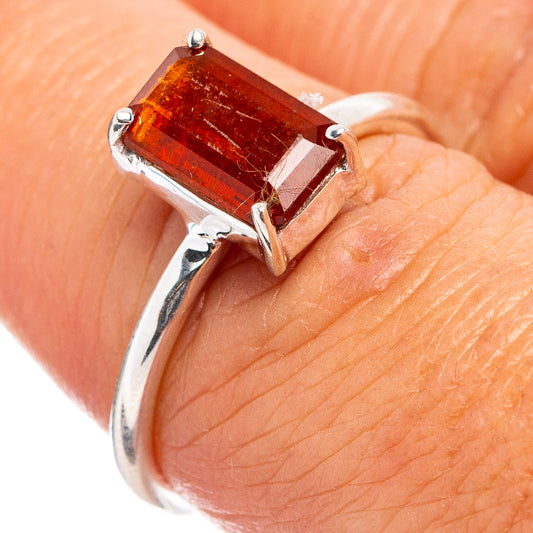 Orange kyanite ring in .925 sterling silver, square-cut prong-set stone on finger